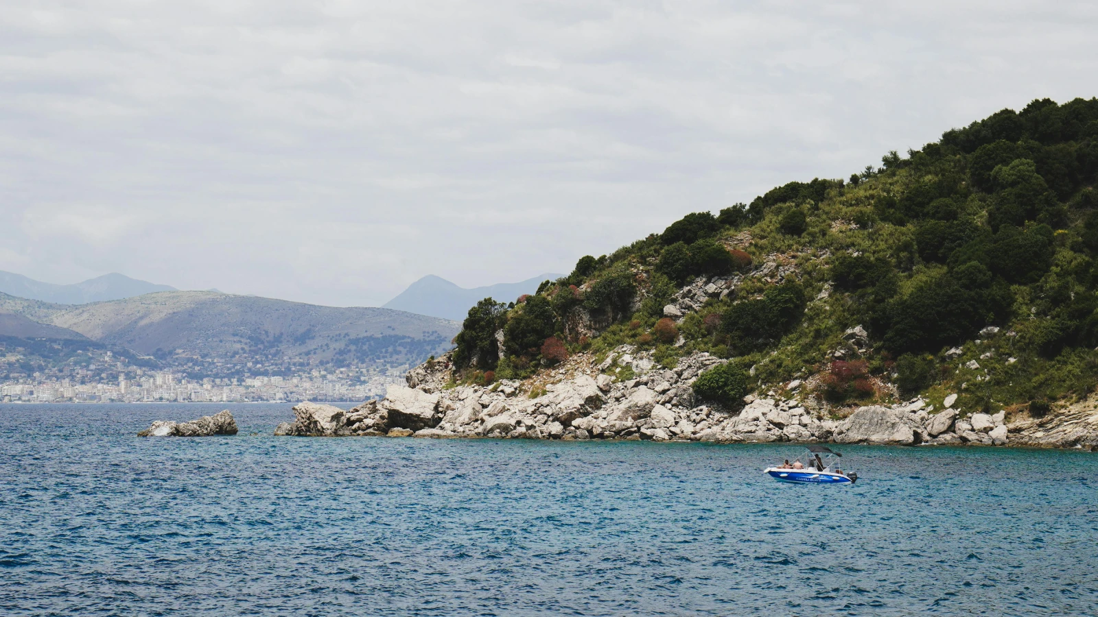 Sarandë city waterfront and Ionian Sea viewed from a rental car drive