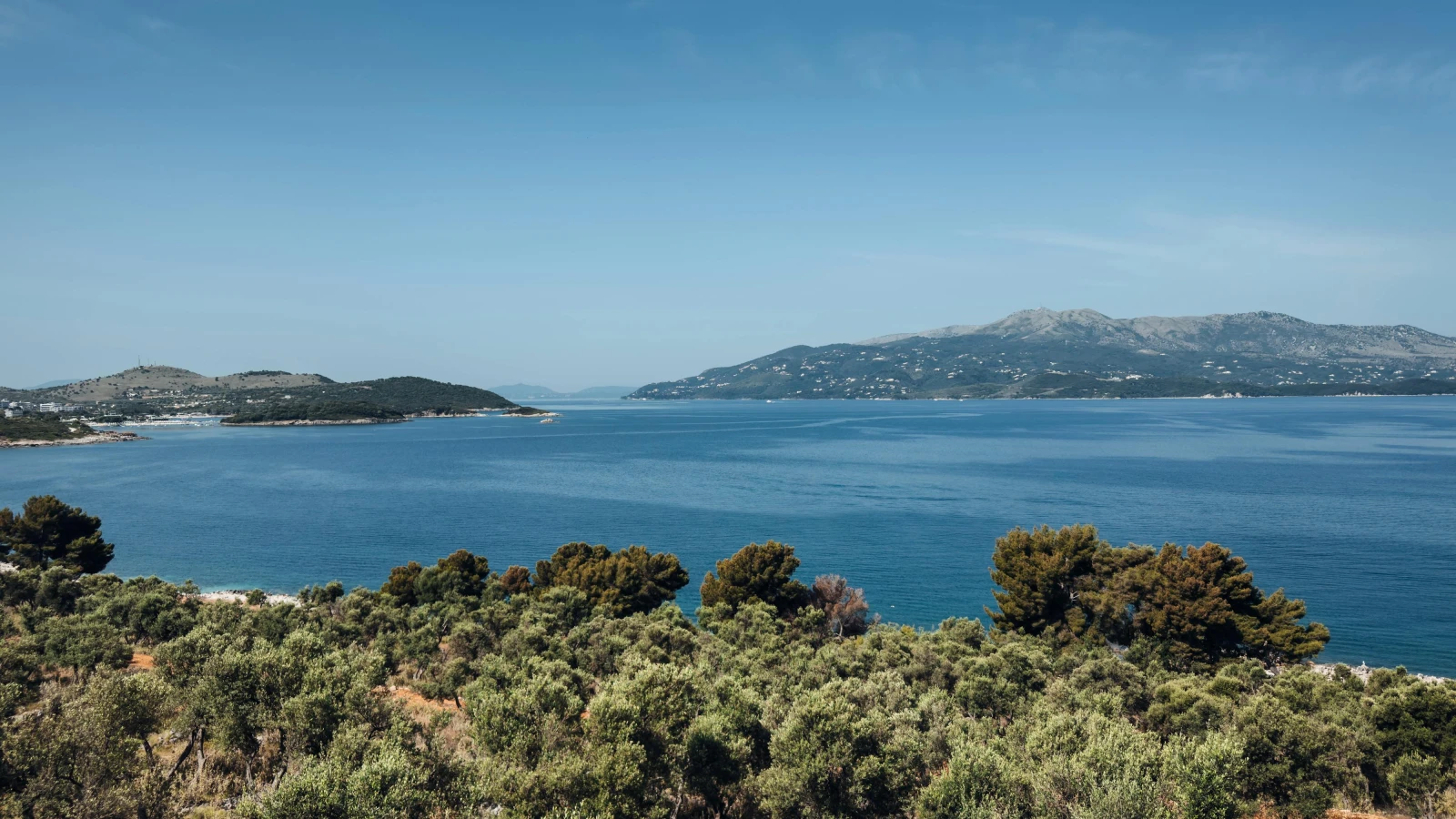 360-degree panoramic view from Sarandë hilltop showing bay, islands and mountains